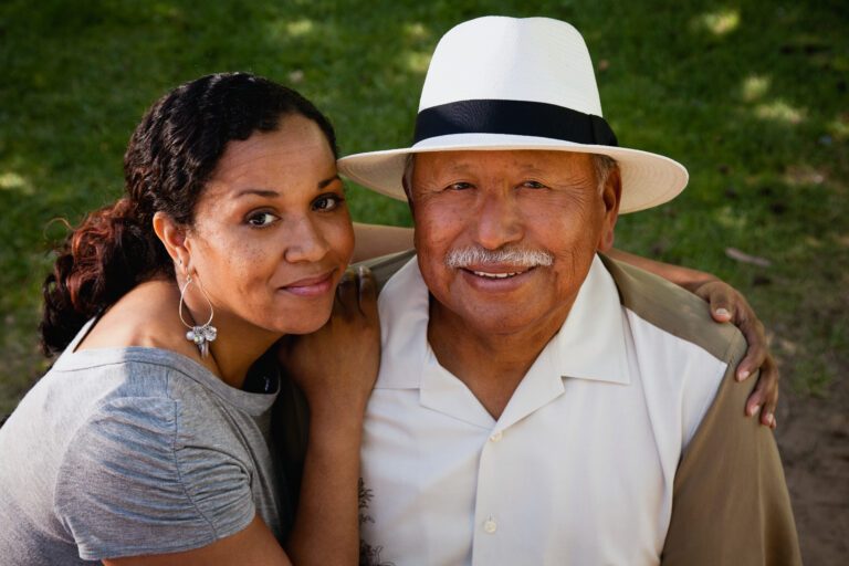 Hispanic woman hugging her father, portrait